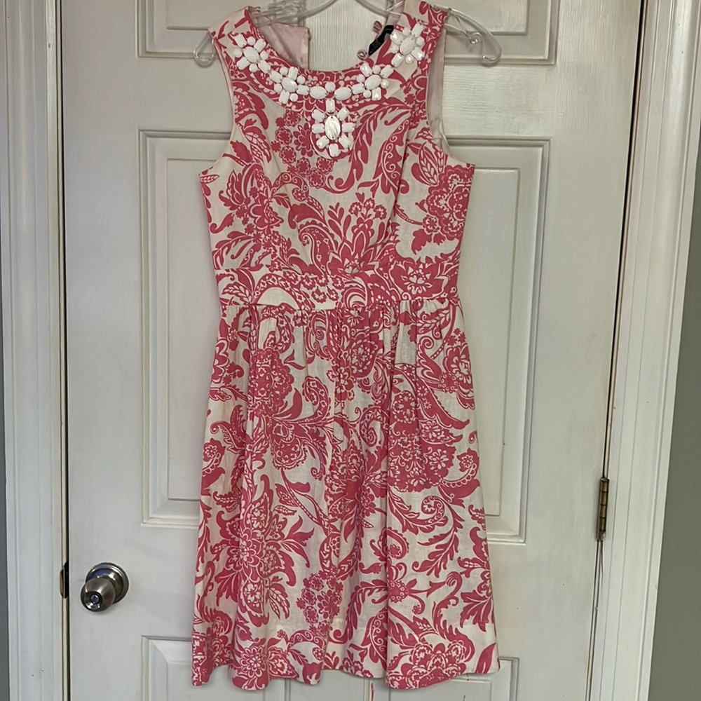 Pink and white dress.